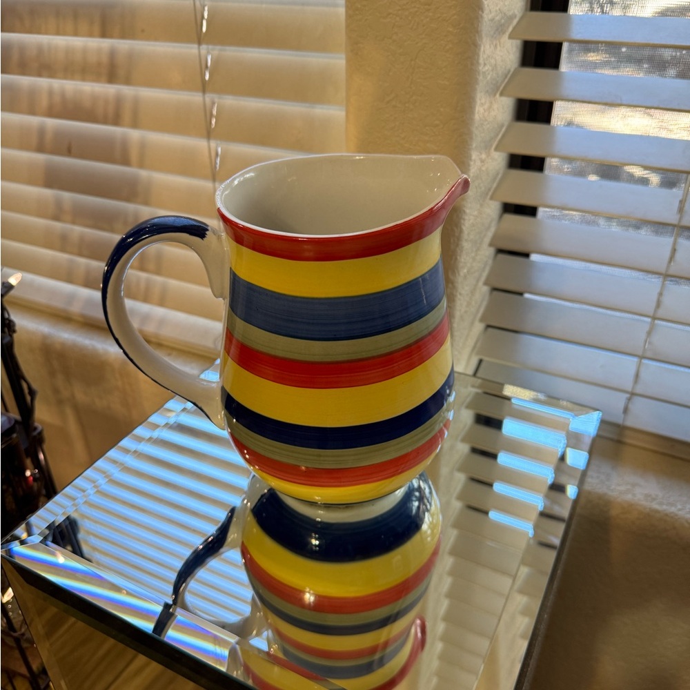 Beautiful Swirl brand multicolored pitcher that is hand painted.